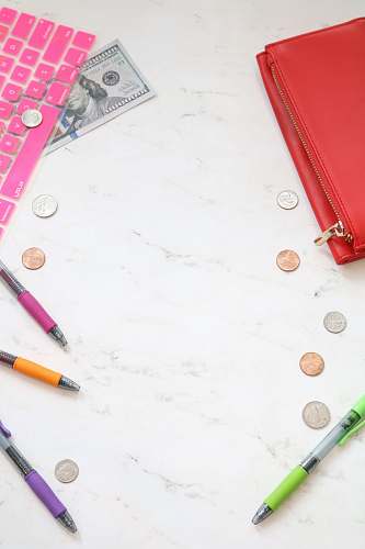 money photo assorted-color pens on top of table money styled stock